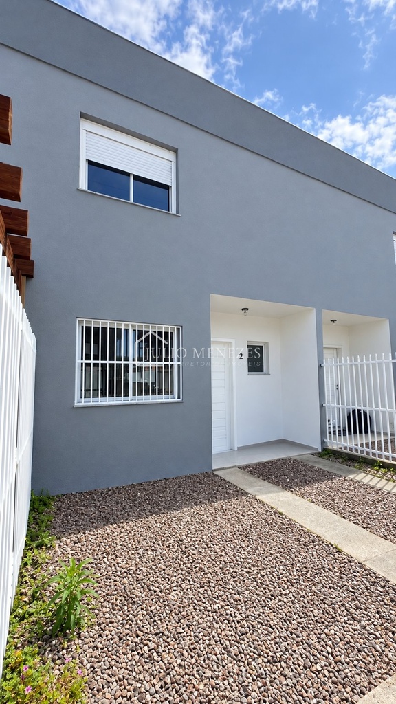 Fachada renovada de sobrado moderno.png